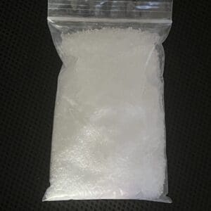 A bag of white substance on top of a table.