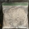A bag of white stuff sitting on top of a table.